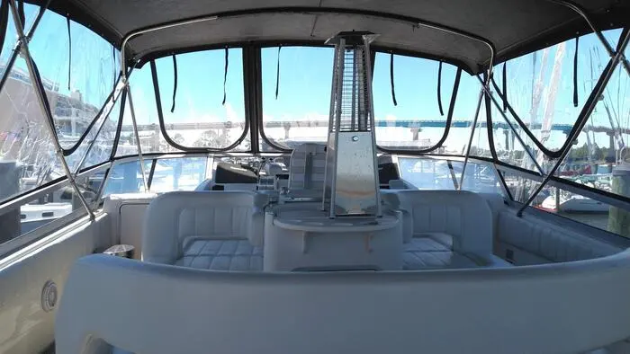 Flybridge seating area with helm aboard GITSOMRAYS