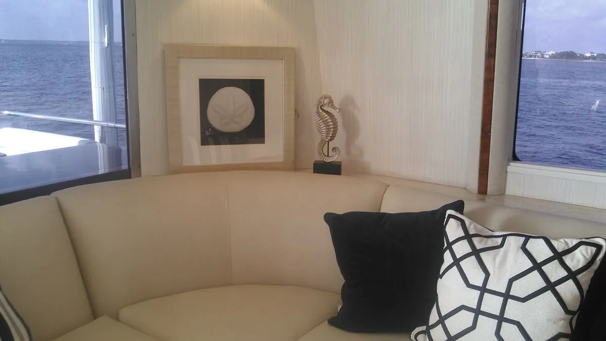 Bright salon lounge aboard the 76-foot Lazzara At Ease with panoramic water views
